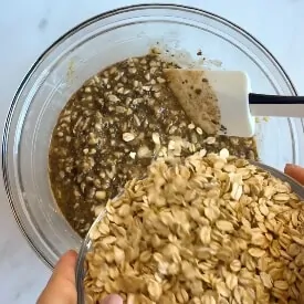 Oats been added to a bowl
