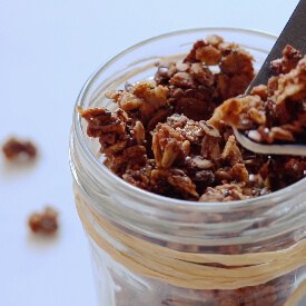 Granola been poured into a glass jar