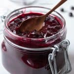 Homemade elderberry jam in a glass jar