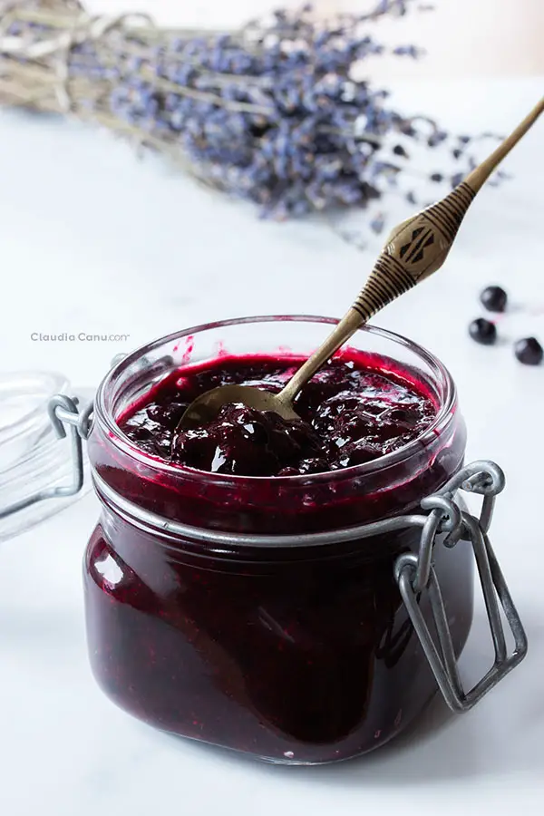 Homemade elderberry jam in a glass jar