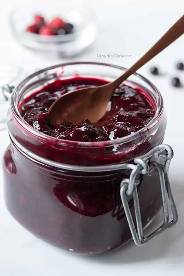 Homemade elderberry jam in a glass jar