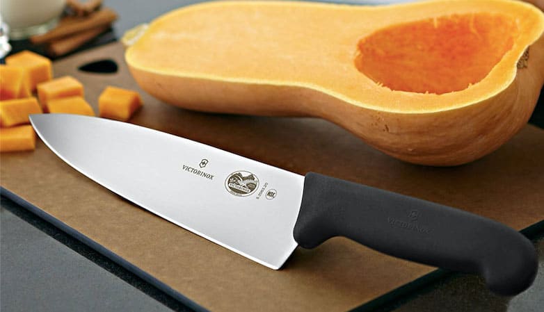 Knife Victorinox in front of a pumpkin, a kitchen essential