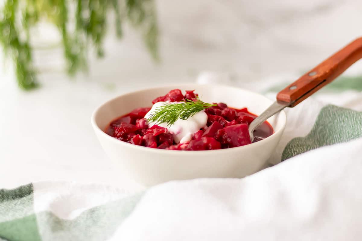 Vegetarian borscht with chickpeas in a white bowl