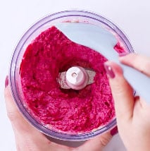 Scraping sides of the food processor while making beetroot hummus